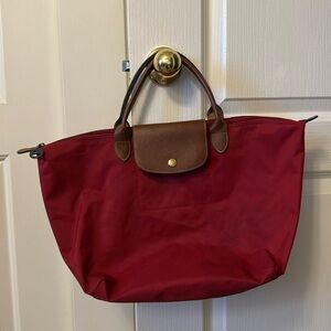 Longchamp Cherry Red Tote with Brown Accents, gently Used comes with dust bag.